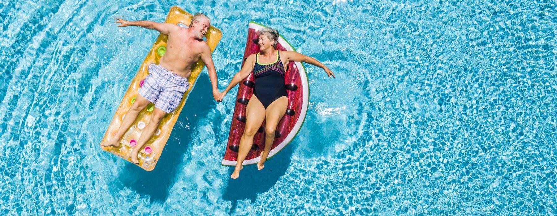 a couple of people in swimsuits in the water