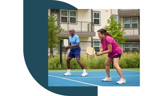 a couple of people playing pickleball